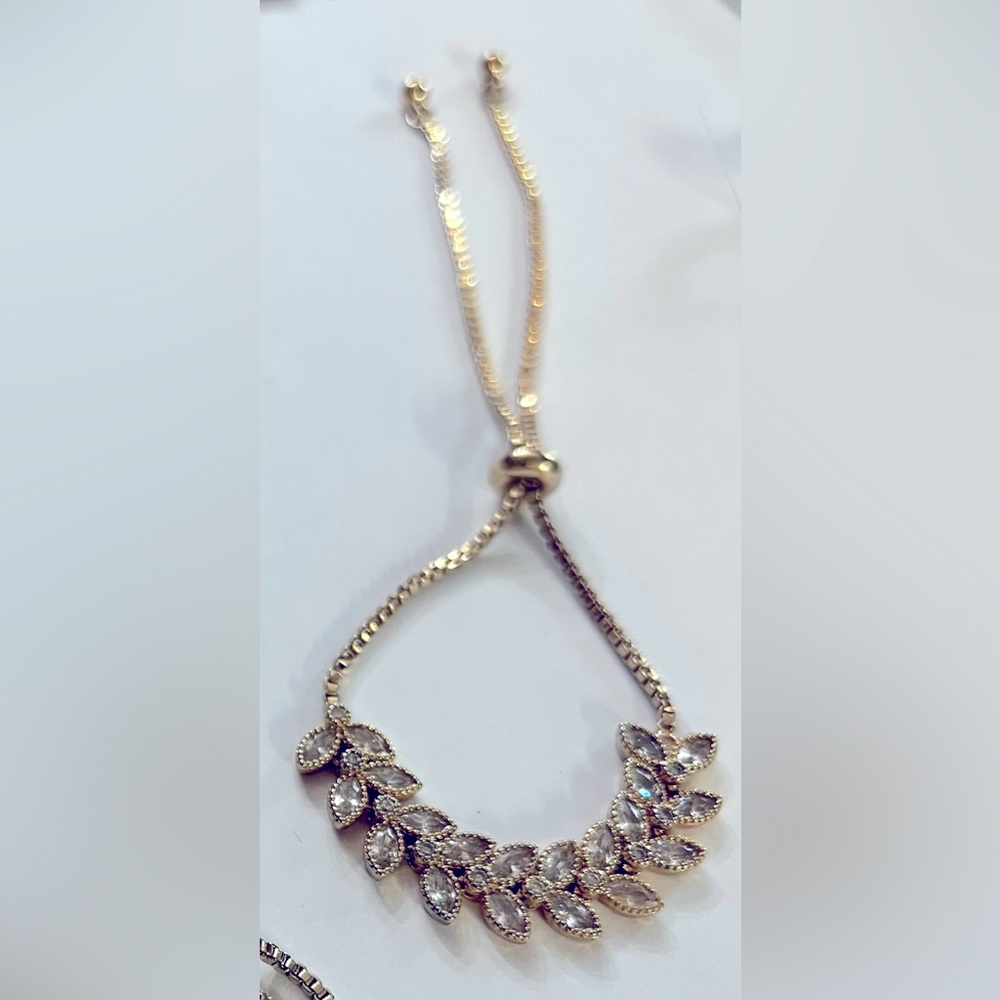 Dainty gold tone and white gemstone